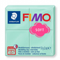 A close-up photograph of one block of light mint green STAEDTLER Fimo Soft polymer modelling clay, focusing on its specific shape and logo markings.