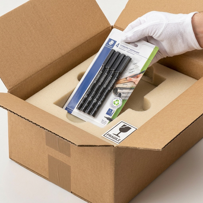 A close-up unboxing shows a custom protective foam insert holding 4 STAEDTLER markers and the sealed blister pack.