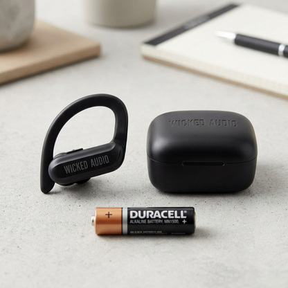A detailed scale reference shot shows the Wicked Audio Raen earbud resting next to a standard AA battery.