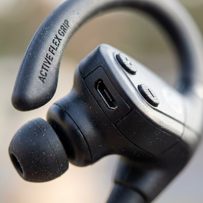 Macro photo and textural view of the Wicked Audio Raen earbud showing a micro-USB charging port.