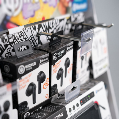 Extreme close-up of a wicked audio holiday display showing earbud packages and plastic peg hooks