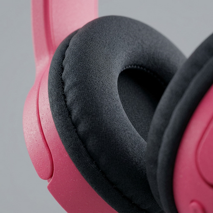 Extreme close-up macro texture of pink Wicked Audio Rad Rascal headphone padding and seam.