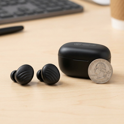 Wicked Audio Mojo 300 earbuds and charging case shown next to a US quarter for scale comparison.