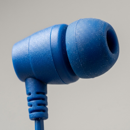 Macro photo of the matte blue plastic earpiece and black coiled cable strain relief.