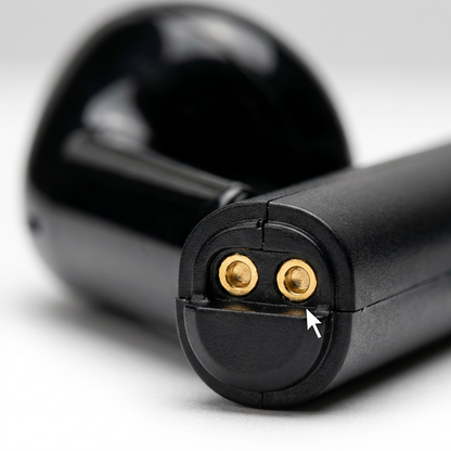 Macro of gold-plated charging pins and base of Wicked Audio Driftr earbud, showing precise construction.