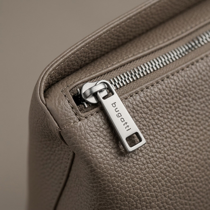 Macro detail of a Bugatti Taupe Tote Bag showing the textured vegan leather and metal zipper pull.