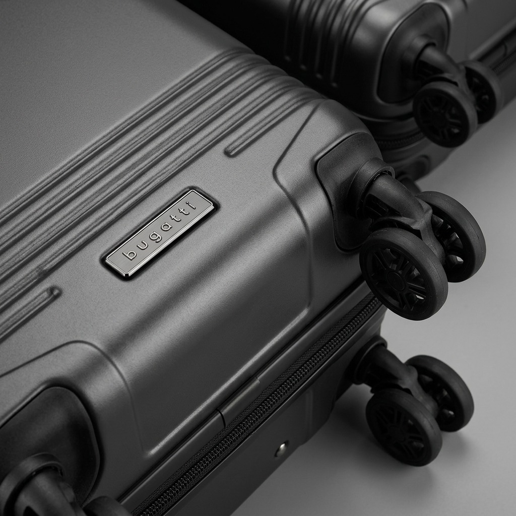 Macro detail of charcoal Bugatti Nashville carry-on luggage showing textured recycled PET shell and 360-degree wheels.