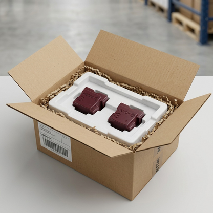 Realistic ecommerce visual: Xerox 108R00927 Magenta Solid Ink sticks, precisely as specified including shape and embossed 'Xerox 3' logo, are shown securely nestled in protective foam inserts within an open shipping carton, illustrating safe unboxing.